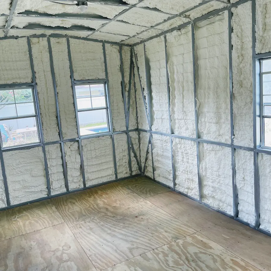 Closed-cell spray foam insulation applied to wall cavities in a residential project in Freetown